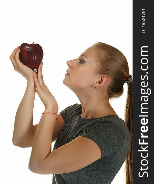 The blonde with an apple on a white background