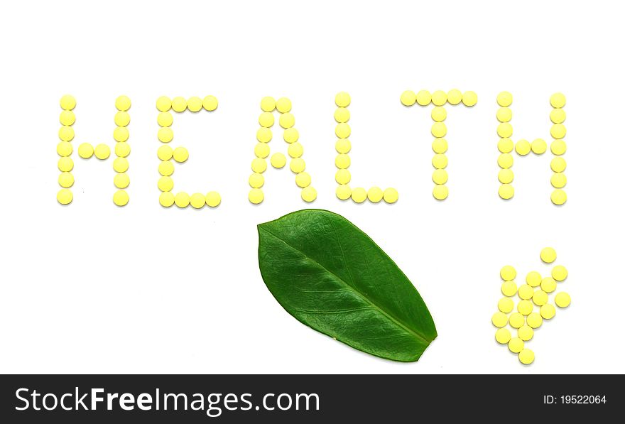 Word HEALTH made from yellow medication pills