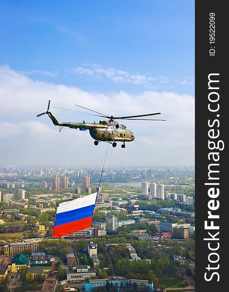 Helicopter with russian flag over Moscow at parade of victory day - aerial view