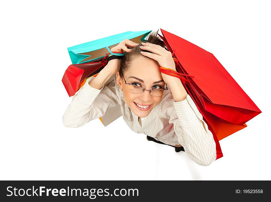 Top view of stylish woman swinging her arms  with shopping bags over white. Top view of stylish woman swinging her arms  with shopping bags over white