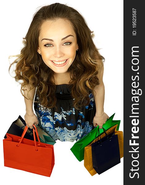 Top view of stylish woman swinging her arms  with shopping bags over white. Top view of stylish woman swinging her arms  with shopping bags over white