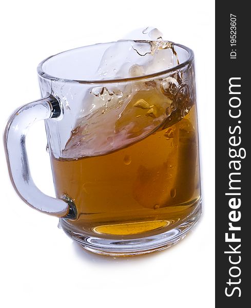 Glass cup of tea with lemon on a white background