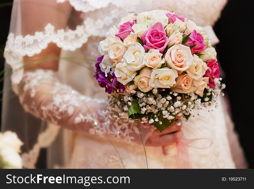 Wedding bouquet in hands of the girl