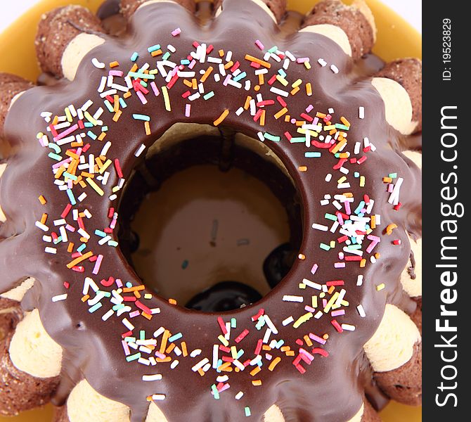 Bundt Cake, covered with chocolate and sprinkles