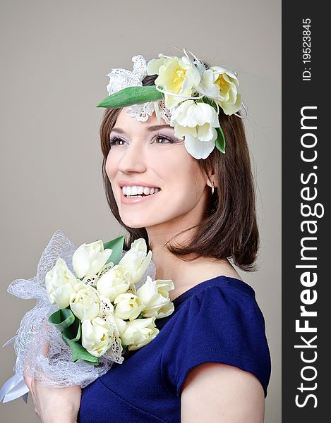 Beautiful young woman with white flowers in hair