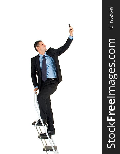Businessman on a ladder in white background