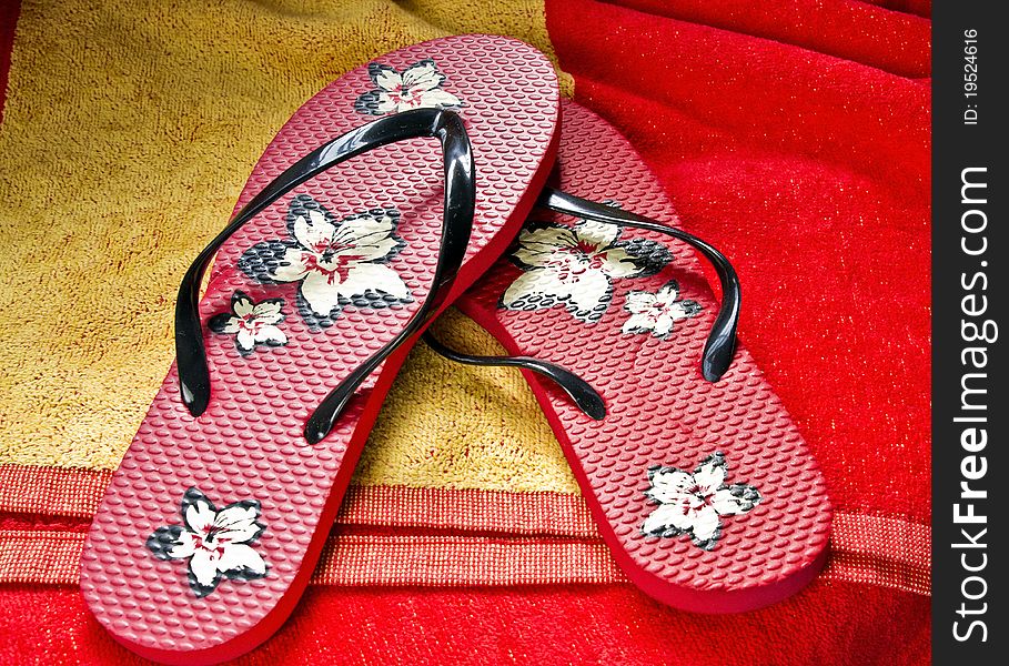 Flipflops on a beach towel with amazing colors