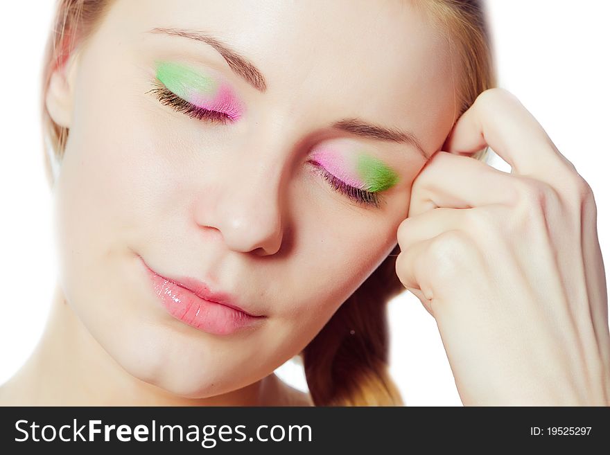 Close-up portrait of beautiful girl with bright makeup