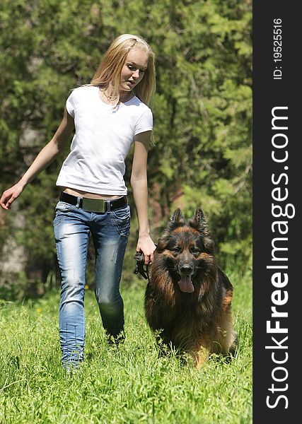 Young girl with dog outdoors