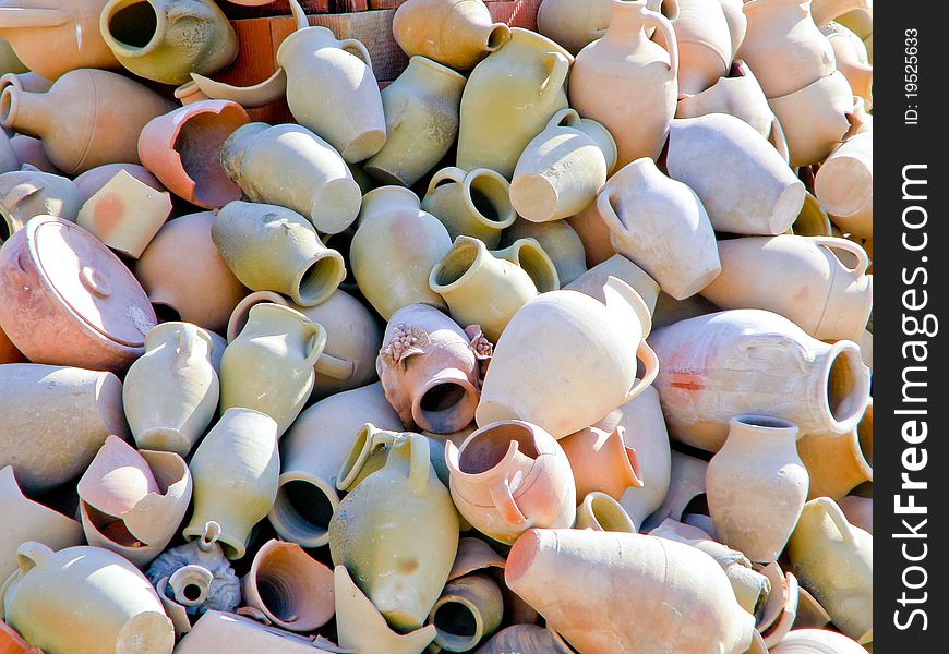 Pile of broken clay mugs and dishes