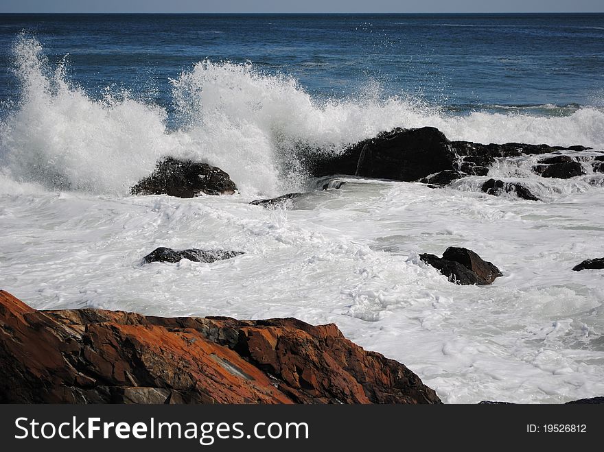 Waves crashing along the shore in Maine. Waves crashing along the shore in Maine