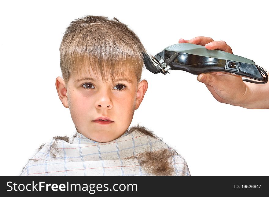 Boy mows clipper. Isolated on white background photo.