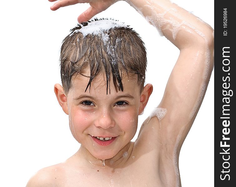 A boy swims in the bathtub. Isolated on white background picture