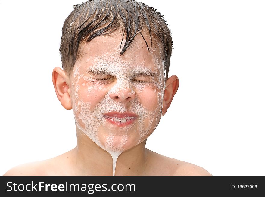 A boy swims in the bathtub. Isolated on white background picture