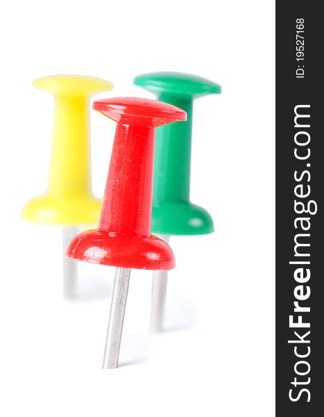 Closeup of multi-colored paper clips on white