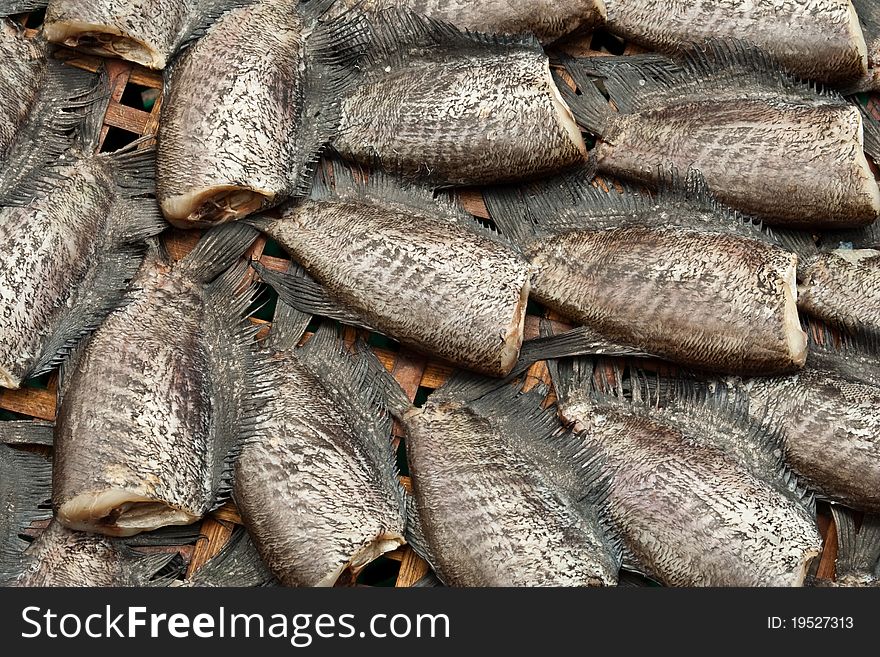 Thai style dried gourami on bamboo