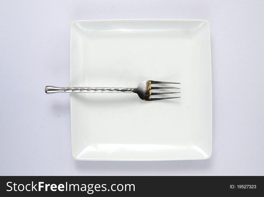 Empty plate with fork