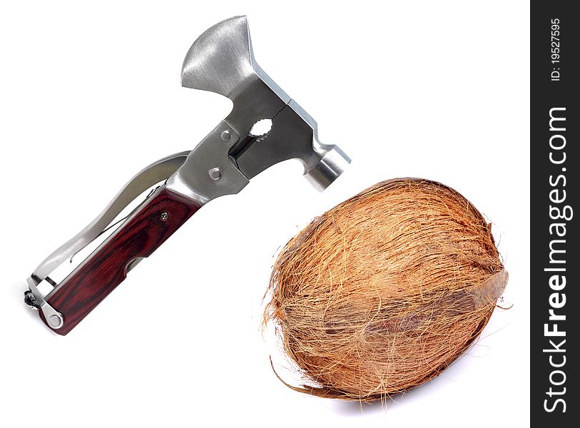 Breaking coconut with steel hammer isolated on white background.