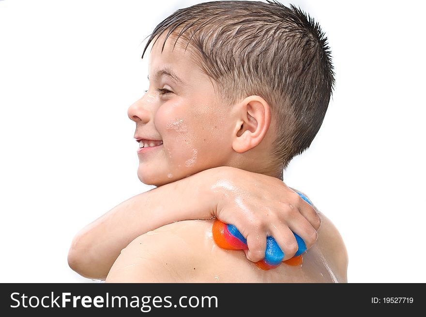 A boy swims in the bathtub. Isolated on white background picture