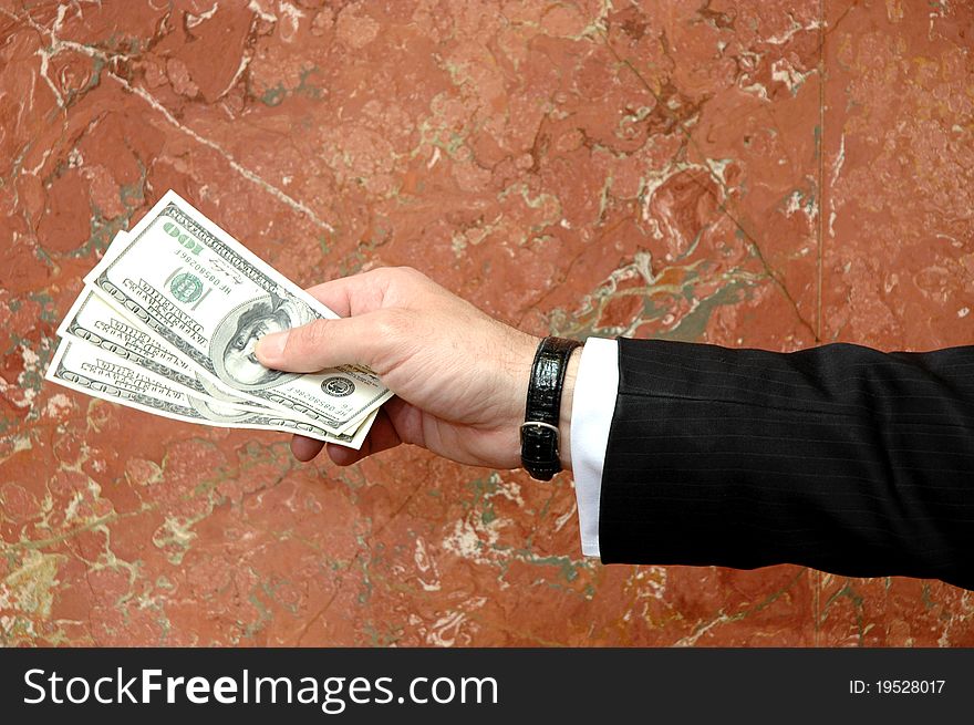 Businessman with dollars bills in the hand