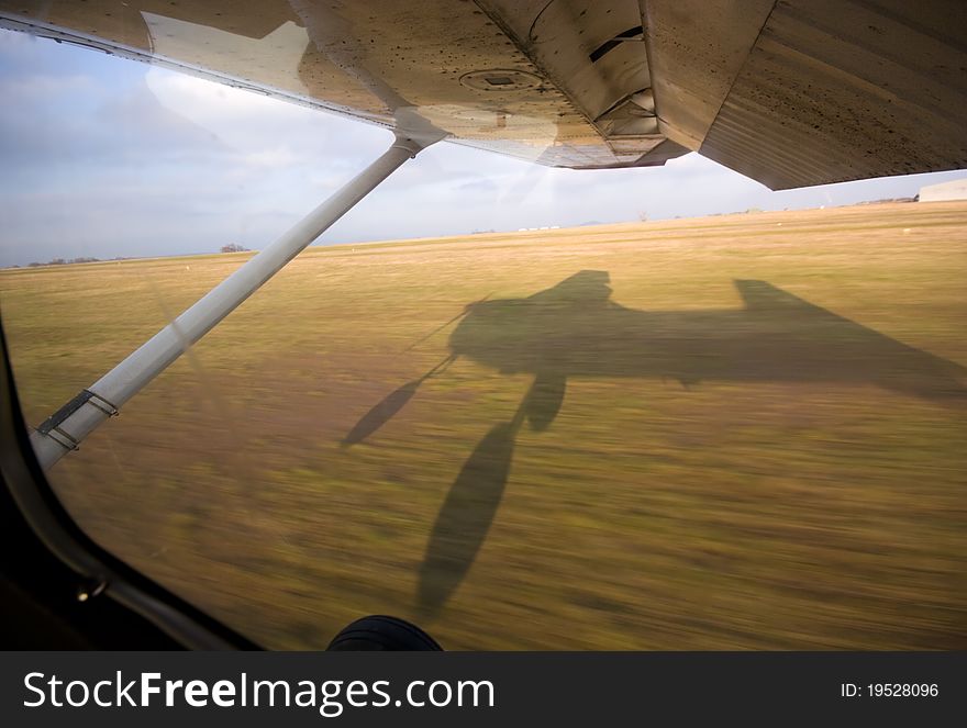 Shadow of a small aircraft while landing. Shadow of a small aircraft while landing