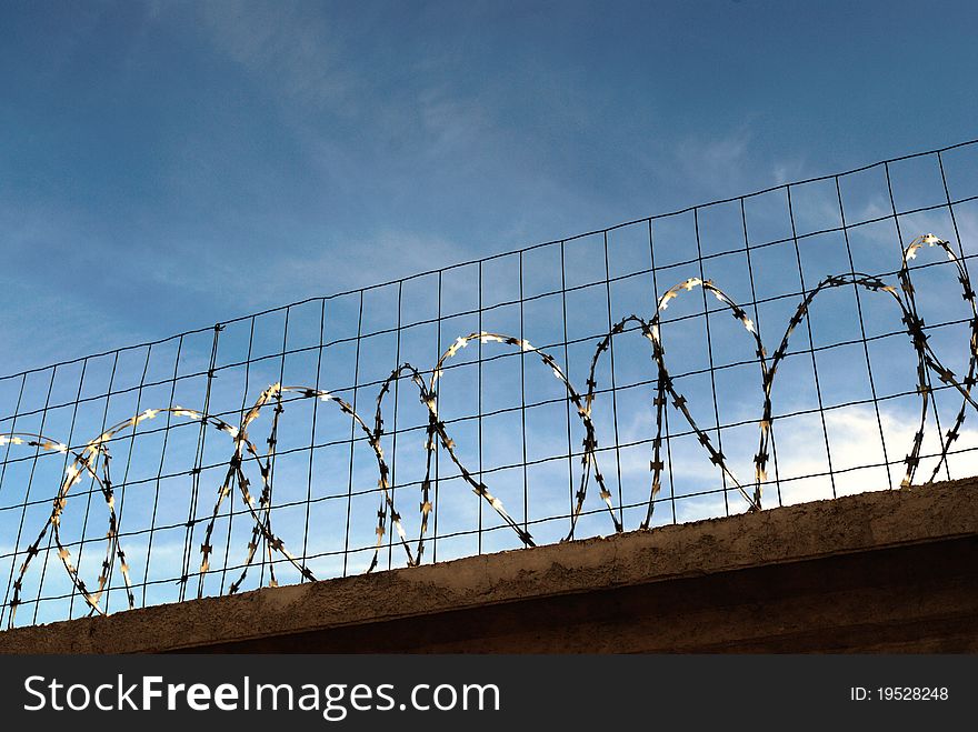 Barbed wire on a blue sky