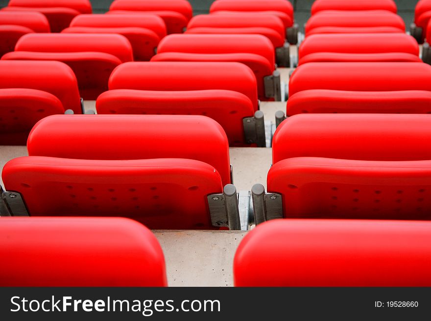 Empty red seats at the football stadium. Empty red seats at the football stadium