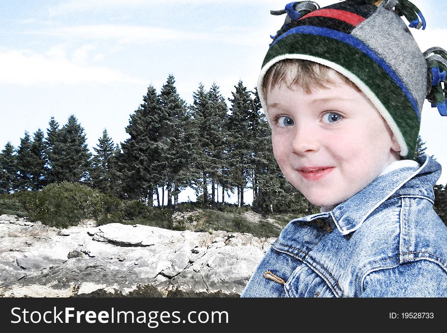 Attractive five year old caucasian boy in hat and jacket at lake park in snow. Attractive five year old caucasian boy in hat and jacket at lake park in snow.