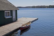 Canoe On Lake Docked By Boat House Royalty Free Stock Image Canoe On Lake Docked By Boat House Royalty Free Stock Image