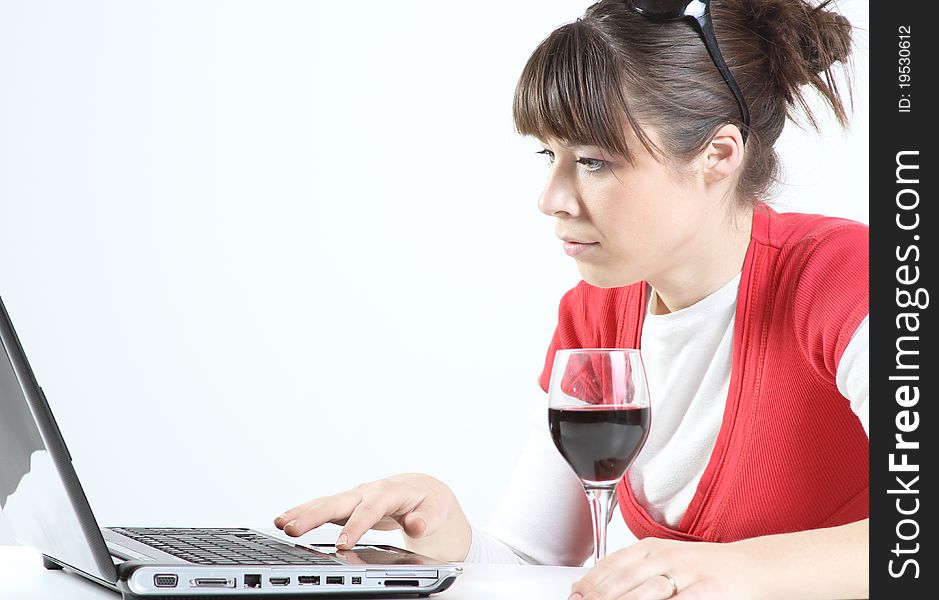 Young woman drink glass of wine at work. Young woman drink glass of wine at work