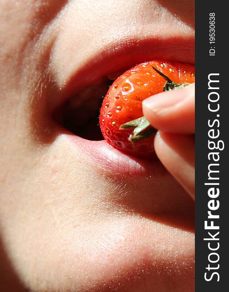 Womans mouth romantic eating freash strawberry. Womans mouth romantic eating freash strawberry