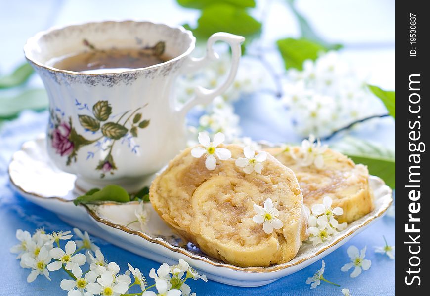 Baked roulades filled with apples and cup of tea. Baked roulades filled with apples and cup of tea