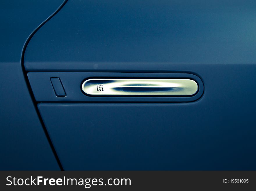 Aluminum door handle on a blue car