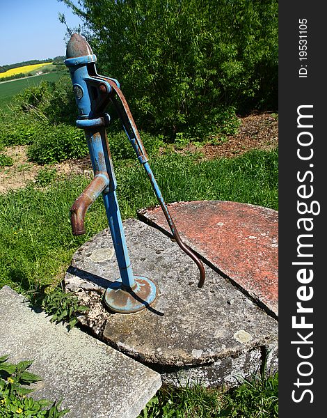 Old abandoned water pump on a village periphery. Old abandoned water pump on a village periphery.