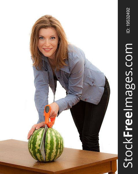 Beautiful young woman sawing the watermelon. Beautiful young woman sawing the watermelon