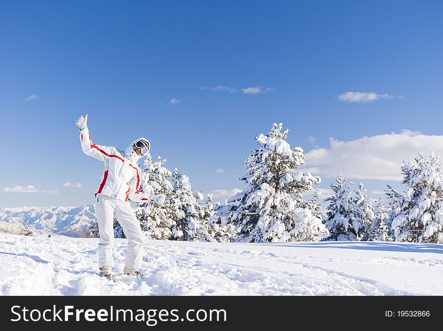 Happy Skier On The Top Of Mountain