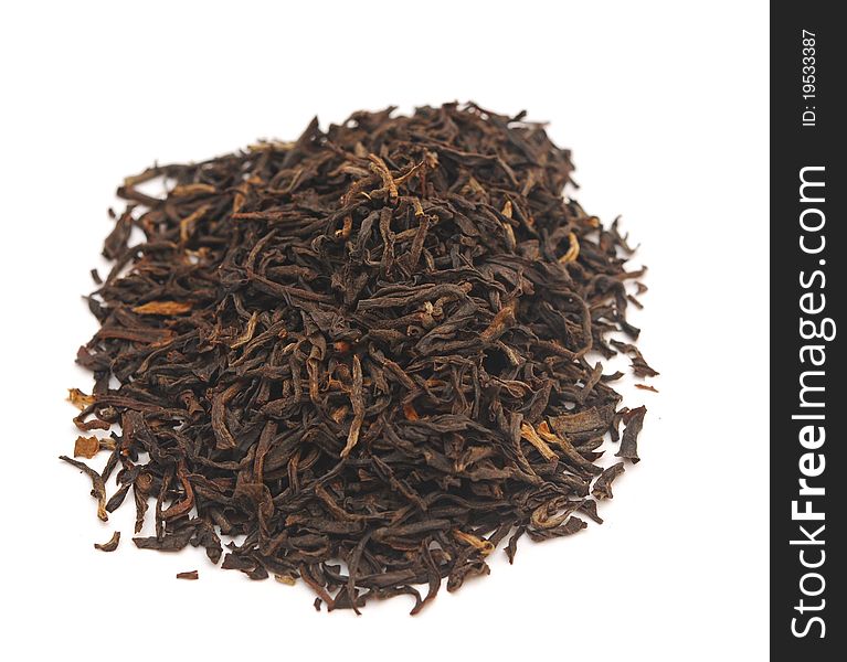 Handful of black tea leaves on white background