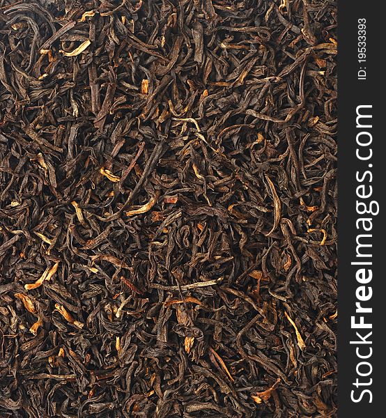 Handful of black tea leaves on white background