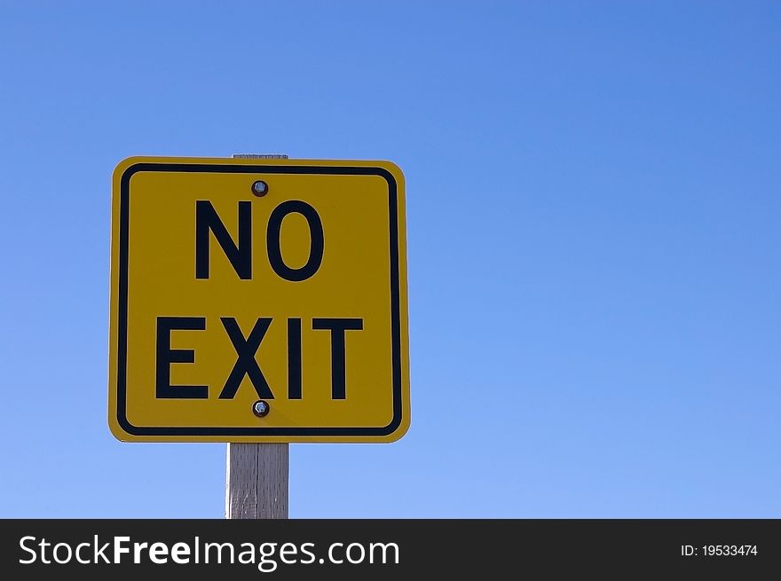 Horizontal picture of a square metal black on yellow No Exist road sign. Shot against a clear blue sky, clipping paths. Horizontal picture of a square metal black on yellow No Exist road sign. Shot against a clear blue sky, clipping paths.