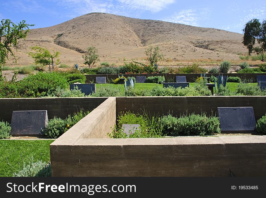 A cemetery in Riverside,CA with tombstones and a garden like setting. A cemetery in Riverside,CA with tombstones and a garden like setting.