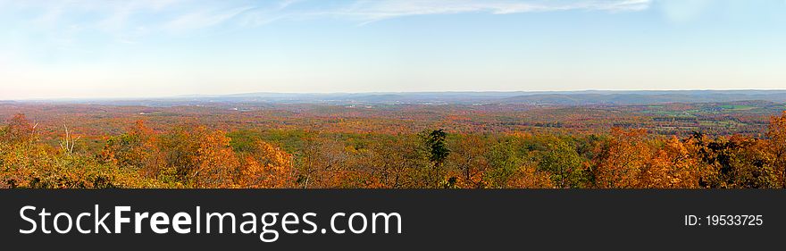 A panoramic shot of valleys and mountains in autumn. A panoramic shot of valleys and mountains in autumn.