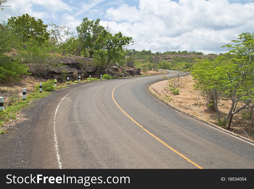 Road Beside Mountain And Blue Sky