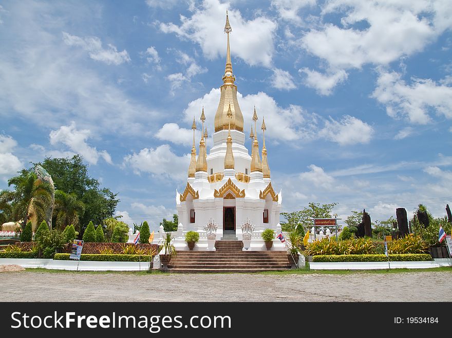 Golden Pagoda and blue sky in Wat Tham Khuha Sawan,Ubonratchathanee Province, Thailand.