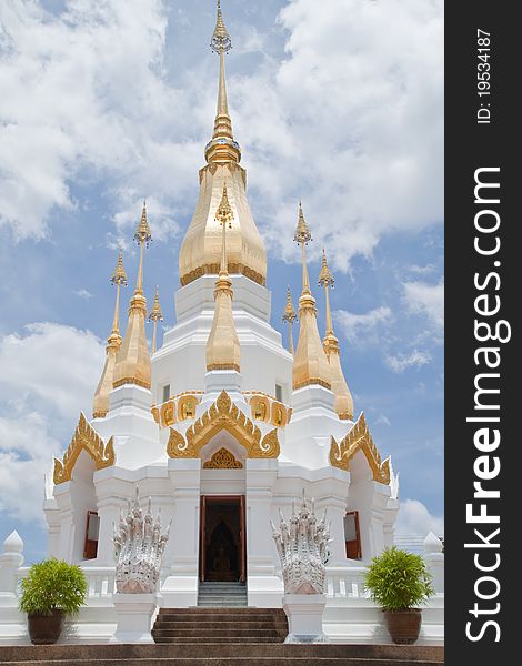 Golden Pagoda and blue sky in Wat Tham Khuha Sawan,Ubonratchathanee Province, Thailand.