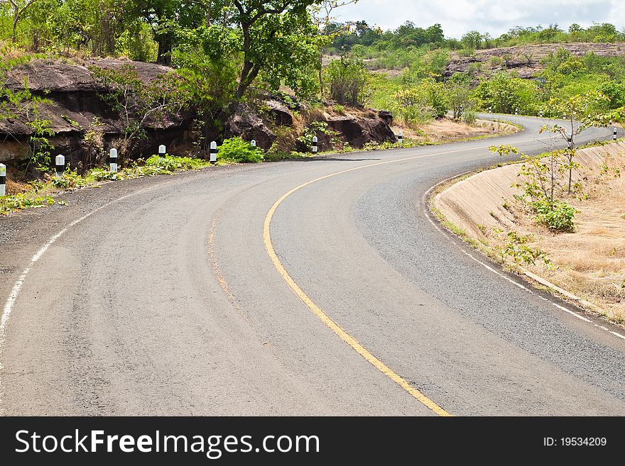 Road beside Mountain and blue sky in Countryside,Pha Taem National Park,North East of Thailand