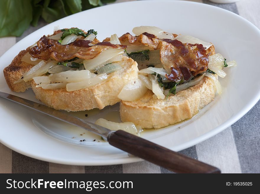 Sourdough with caramelised onions, watercress and bacon. Sourdough with caramelised onions, watercress and bacon