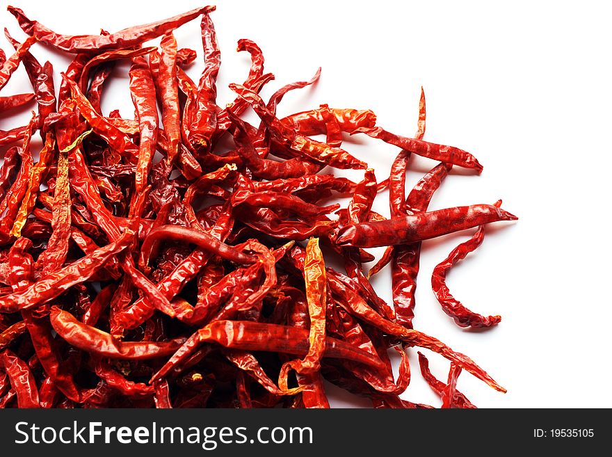 Dried red chili peppers on white background