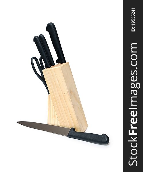 Kitchen knives set in the wooden block. Isolated on white with clipping path