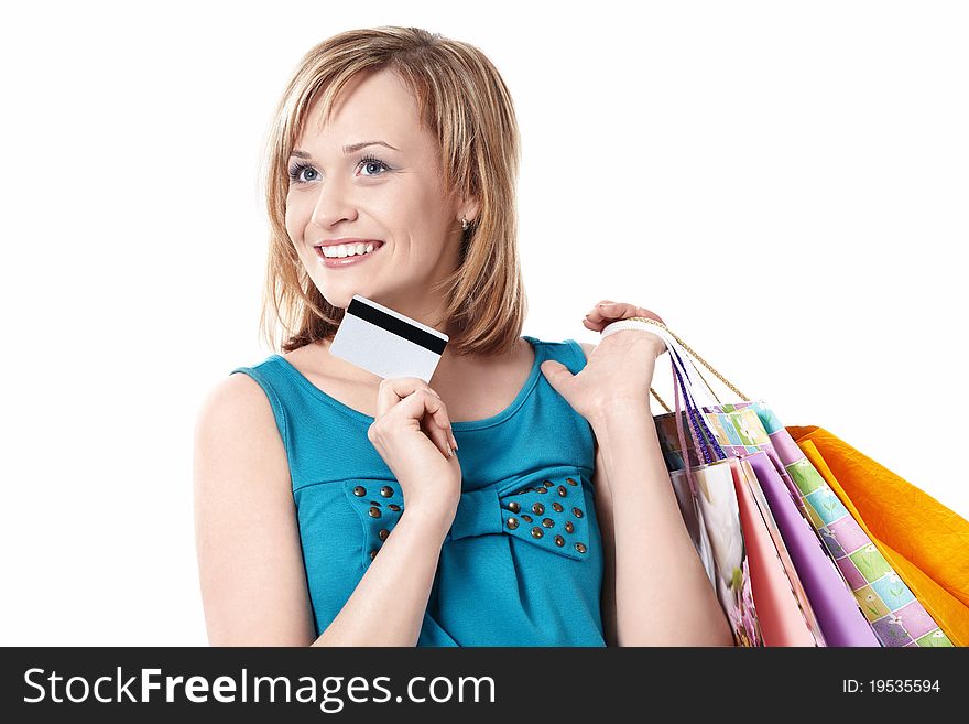 Girl with bags and credit card on a white background. Girl with bags and credit card on a white background