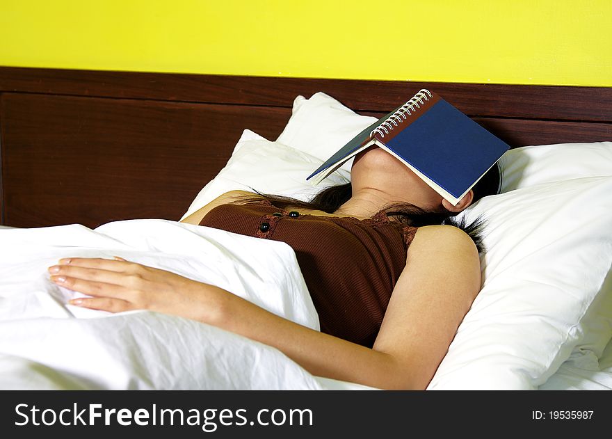 Woman with a book in bedroom. Woman with a book in bedroom